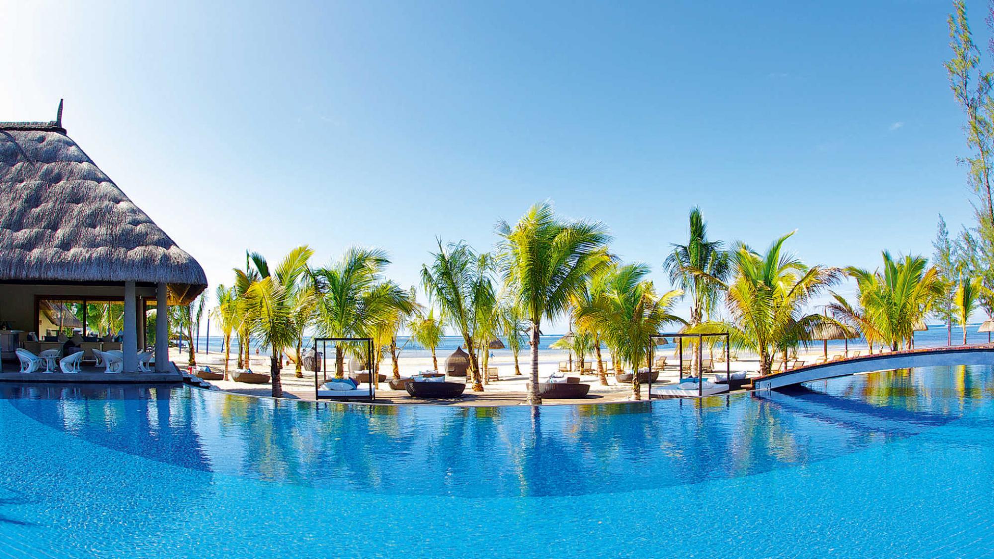 The Heritage Le Telfair Golf  Spa Resort's picturesque main pool situated in impressive Mauritius.